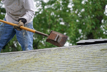 Wall Mural - handy man working on repairing the roof