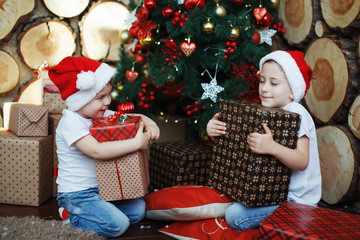 Wall Mural - Two brother boys in Christmas hats.