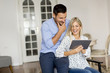 © BGStock72 - Young couple with tablet in the room