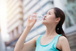 © Quality Stock Arts - healthy sport cute asian teen drinking water city background