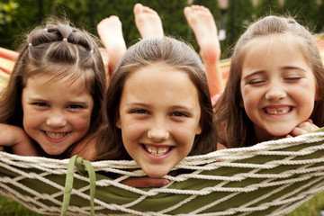 happy children lying on the grass