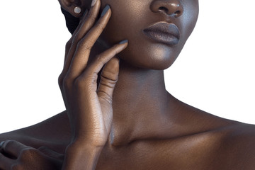 Palm and lips of young beautiful black woman with clean perfect skin close-up