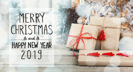 Wall Mural - Merry Christmas and Happy New Year text with gift boxes