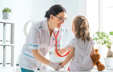 Wall Mural - doctor examining a child