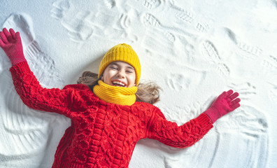 Wall Mural - Kid making snow angel.