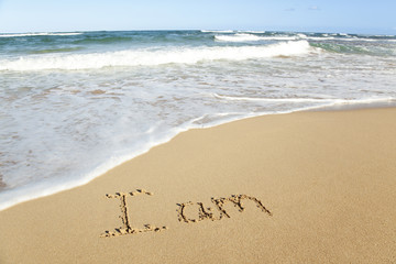 Poster - word written in sand on the beach