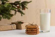 Milk And Cookies For Santa Claus Under The Christmas Tree. Concept, Copy Space.