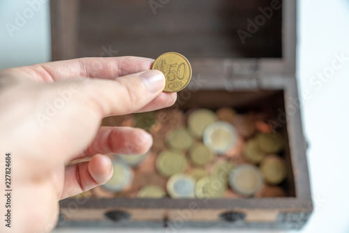 Hand Holding 50 Cent Coin In Front Of Chest Stock Photo Adobe Stock Hand Holding 50 Cent Coin In Front Of Chest Stock Photo Adobe Stock