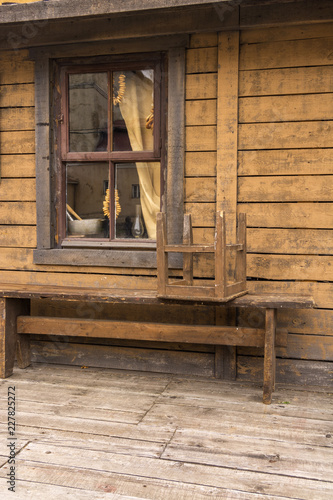 Bagels Hanging In The Window Of A Village House Bench In Front Of