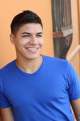 Wall Mural - Cute South American young man smiling 