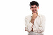 © Ranta Images - Studio shot of young happy Persian businessman smiling while thi