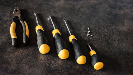 black and yellow screwdrivers close-up