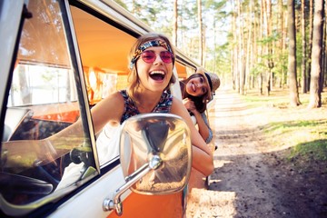 Hipster friends on road trip on a summers day