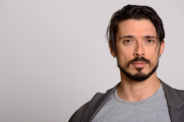 Studio shot of handsome man wearing jacket