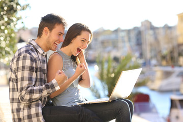 Poster - Excited couple on vacation watching online content