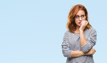 Young Beautiful Woman Over Isolated Background Wearing Glasses Looking Stressed And Nervous With Hands On Mouth Biting Nails. Anxiety Problem.