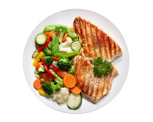 Plate Of Grilled Chicken With Vegetables On Wite Background, Top View
