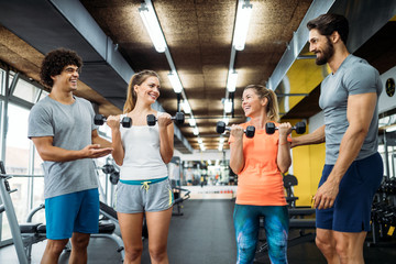 Picture of cheerful fitness team in gym