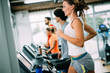 © NDABCREATIVITY - Picture of people running on treadmill in gym