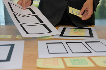user experience ux designer designing web on smartphone tablet layout. ui planning mobile applicatio