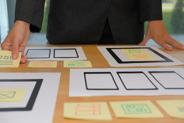 user experience ux designer designing web on smartphone tablet layout. ui planning mobile applicatio