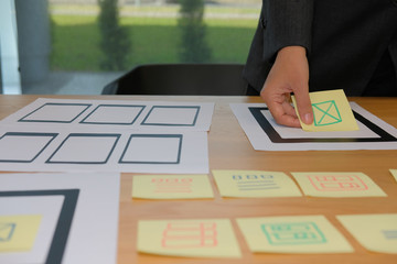 user experience ux designer designing web on smartphone tablet layout. ui planning mobile applicatio