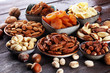 © beats_ - dried fruits and assorted nuts composition on rustic table