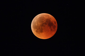 Wall Mural - super bloody moon, full eclipse phase against starry sky background