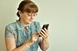 © st_fox - woman holding smartphone