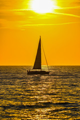 Wall Mural - sailboat at sunset