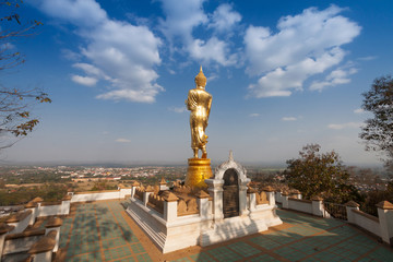 Wall Mural - Buddha standing on a mountain Wat Phra That Khao Noi, Nan Province, Thailand