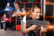 © JackF - Happy young girl with laser gun  during laser tag game with  pla