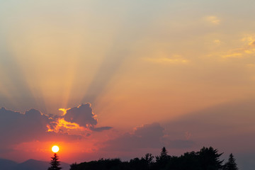 Sunbeams in the clouds at twilight, natural background