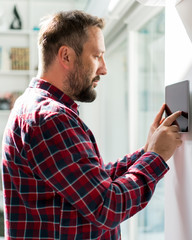Man using smart home device