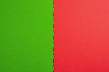 Two blank papers red and green color with figured cutted border. Top view. Education concept