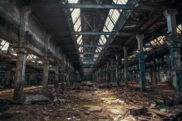  Abandoned ruined industrial warehouse or factory building inside, corridor view with perspective, ruins and demolition concept