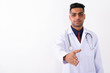 © Ranta Images - Young Indian man doctor against white background