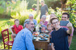© jackfrog - during a bbq a boy does a selfie with the whole family
