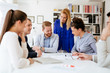 © NDABCREATIVITY - Coworkers working on project together