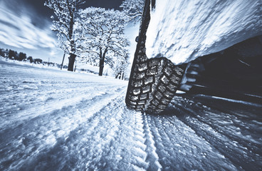 Wall Mural - Closeup of car tires in winter morning