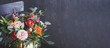 canvas print picture - Autumn floral bouquet in punpkin vase on black chair, banner
