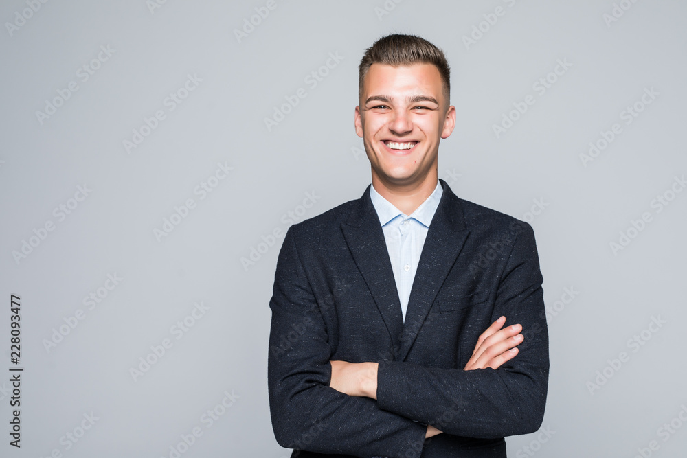 Portrait of businessman with crossed hands, isolated on white background. Concept of leadership and success - obrazy, fototapety, plakaty 