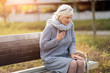 © pikselstock - Senior Woman Suffering From Chest Pain While Sitting On Bench