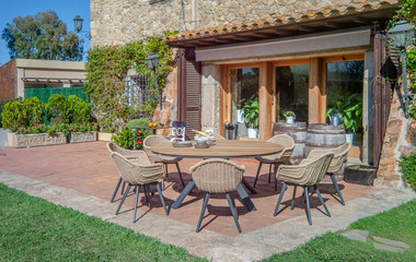 Wall Mural - Garden dining table with chairs.