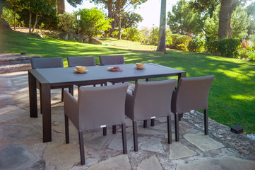 Wall Mural - Garden dining table with chairs.