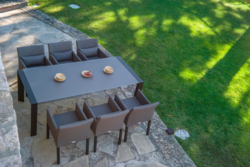 Wall Mural - Garden dining table with chairs.