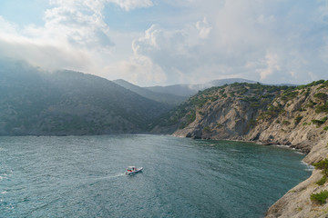 Sea aerial view, Top view, amazing nature background.The color of the water and beautifully bright. Azure beach with rocky mountains and clear water of Crimea at sunny day.