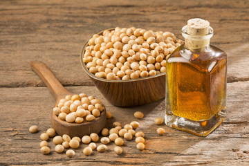 Sticker - Oil and soybeans - Glycine max. Wooden background