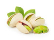 Pistachios with leaves isolated on white background