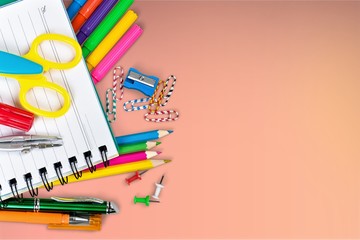 Poster - Colorful school supplies on wooden table background